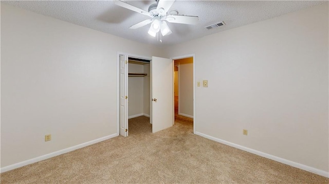 4813 Lake Como Ave, Metairie, LA 70006 - unfurnished bedroom with light carpet, a closet, baseboards, ceiling fan, and a textured ceiling