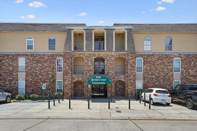 3320 N Arnoult Rd Unit 231, Metairie, LA 70002 - view of building exterior featuring uncovered parking