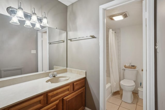 3320 N Arnoult Rd Unit 231, Metairie, LA 70002 - bathroom featuring vanity, toilet, tile patterned floors, and shower / tub combo with curtain