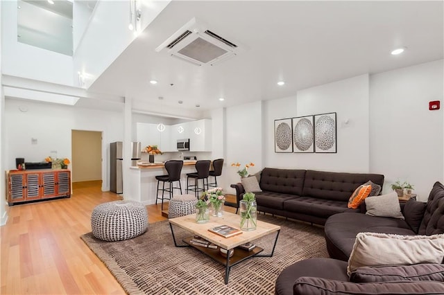 822 N Rampart St Unit 203, New Orleans, LA 70116 - living area featuring light wood-type flooring and recessed lighting