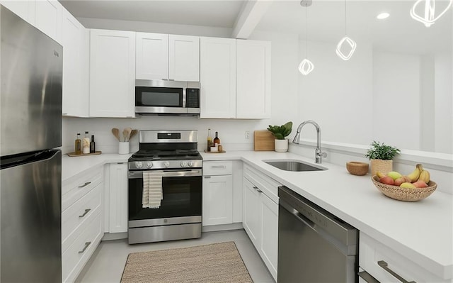 822 N Rampart St Unit 203, New Orleans, LA 70116 - kitchen with appliances with stainless steel finishes, a sink, light countertops, white cabinetry, and recessed lighting