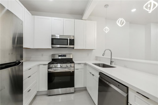 822 N Rampart St Unit 203, New Orleans, LA 70116 - kitchen featuring appliances with stainless steel finishes, a sink, light countertops, white cabinetry, and recessed lighting