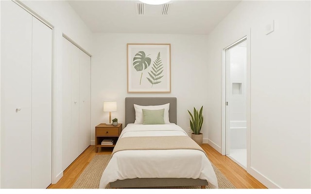 822 N Rampart St Unit 203, New Orleans, LA 70116 - bathroom featuring toilet, vanity, and bath / shower combo with glass door