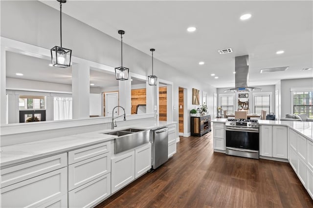 7599 Park Ave, Houma, LA 70364 - kitchen featuring stainless steel appliances, island range hood, a sink, recessed lighting, and white cabinetry