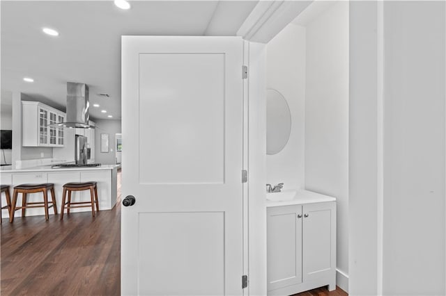 7599 Park Ave, Houma, LA 70364 - bathroom with vanity, recessed lighting, and wood finished floors