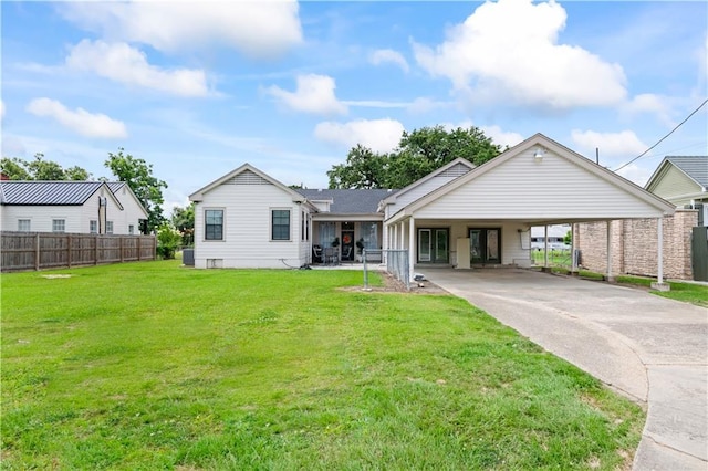 7599 Park Ave, Houma, LA 70364 - view of front facade with driveway and a carport
