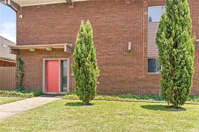 2017 Charles Dr, Chalmette, LA 70043 - view of front of house featuring a front lawn and brick siding