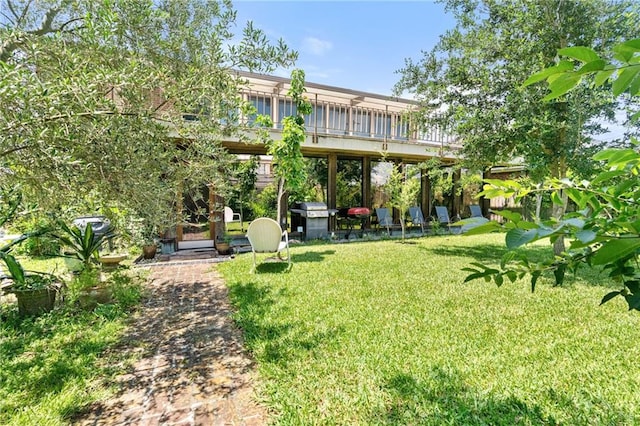 2017 Charles Dr, Chalmette, LA 70043 - rear view of house featuring a yard and a deck