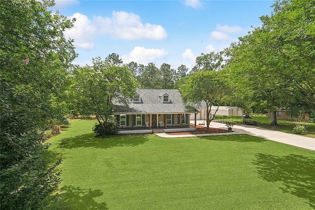 19196 Wildoak Ln, Ponchatoula, LA 70454 - view of front of home with covered porch, concrete driveway, and a front lawn