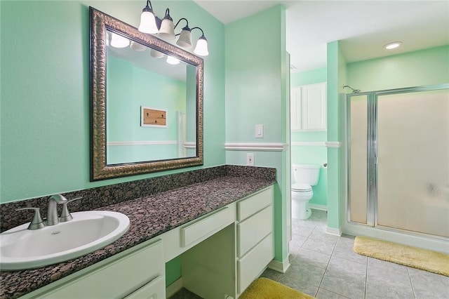 19196 Wildoak Ln, Ponchatoula, LA 70454 - full bathroom with a shower stall, tile patterned flooring, vanity, and toilet