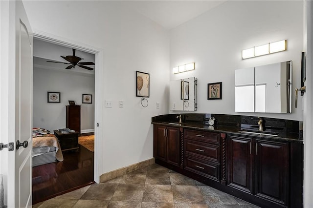 439 S Clark St, New Orleans, LA 70119 - bathroom featuring double vanity, baseboards, and a ceiling fan