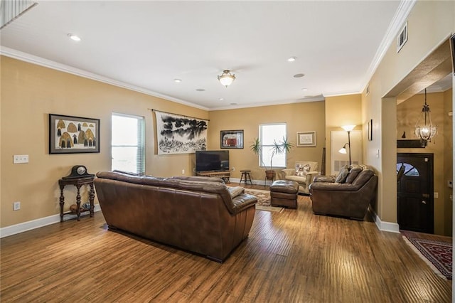 439 S Clark St, New Orleans, LA 70119 - living area with dark wood-style floors, crown molding, baseboards, and recessed lighting