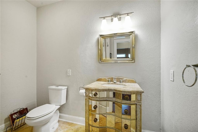 439 S Clark St, New Orleans, LA 70119 - bathroom featuring toilet, vanity, and baseboards