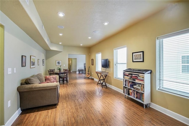 439 S Clark St, New Orleans, LA 70119 - living room featuring wood finished floors, recessed lighting, and baseboards