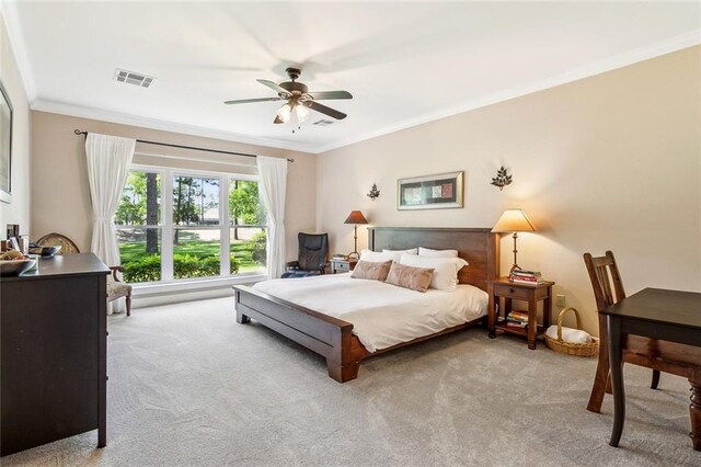 511 Beau Chene Dr, Mandeville, LA 70471 - bedroom with carpet flooring, ornamental molding, and ceiling fan
