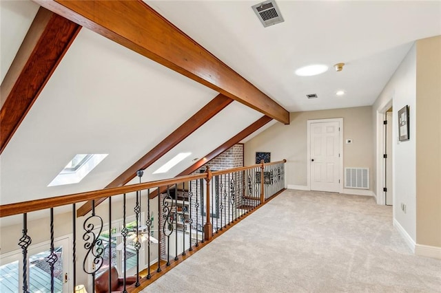 511 Beau Chene Dr, Mandeville, LA 70471 - hall with a skylight, carpet flooring, and baseboards