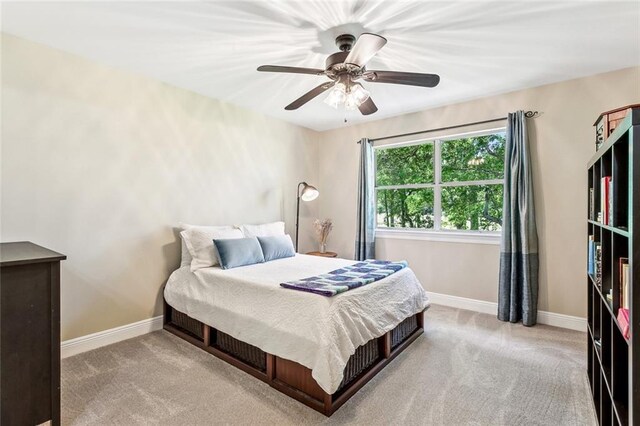511 Beau Chene Dr, Mandeville, LA 70471 - bedroom with carpet, baseboards, and a ceiling fan