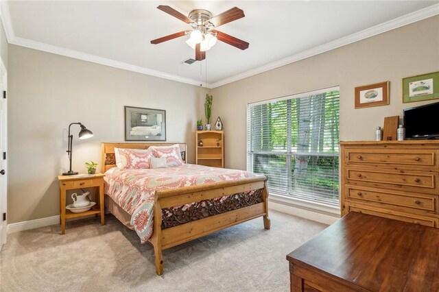 511 Beau Chene Dr, Mandeville, LA 70471 - bedroom featuring crown molding, light colored carpet, baseboards, and a ceiling fan