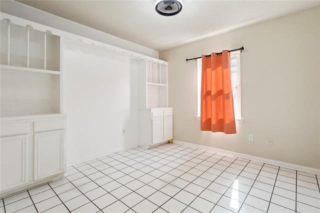 312 Raleigh Dr, Slidell, LA 70460 - unfurnished room with light tile patterned floors and baseboards