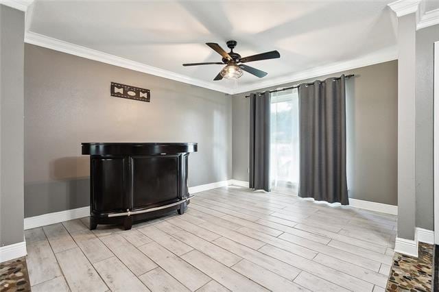 312 Raleigh Dr, Slidell, LA 70460 - unfurnished living room with crown molding, a ceiling fan, baseboards, and wood finished floors