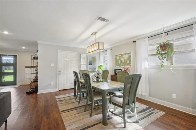 4709 Kawanee Ave, Metairie, LA 70006 - dining room with crown molding, wood finished floors, baseboards, and recessed lighting