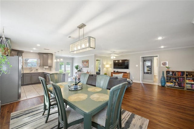 4709 Kawanee Ave, Metairie, LA 70006 - dining room with recessed lighting, ceiling fan, ornamental molding, wood finished floors, and baseboards