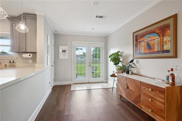 4709 Kawanee Ave, Metairie, LA 70006 - doorway featuring french doors, wood finished floors, baseboards, and ornamental molding
