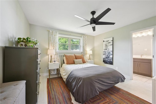 4709 Kawanee Ave, Metairie, LA 70006 - bedroom with baseboards, a sink, ensuite bath, and ceiling fan