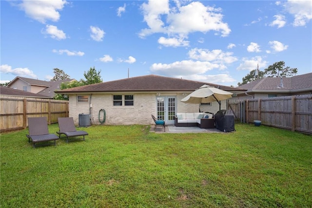 4709 Kawanee Ave, Metairie, LA 70006 - rear view of property featuring an outdoor living space, cooling unit, a patio, and brick siding