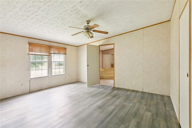 16940 Gunboat Landing Rd, Livingston, LA 70449 - empty room featuring crown molding, wood finished floors, ceiling fan, and a textured ceiling
