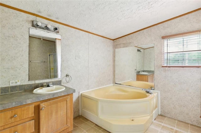 16940 Gunboat Landing Rd, Livingston, LA 70449 - full bathroom featuring wallpapered walls, vanity, crown molding, a garden tub, and a textured ceiling