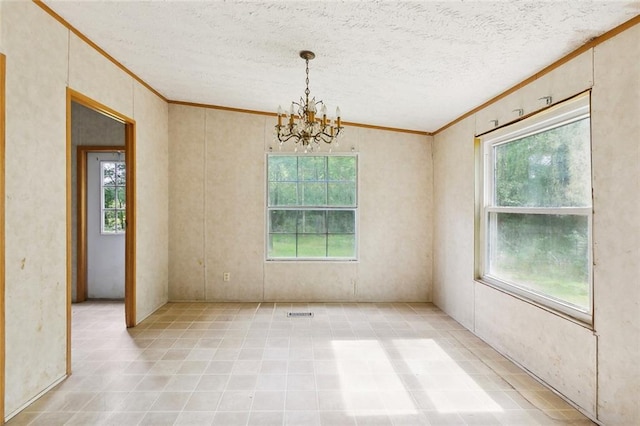 16940 Gunboat Landing Rd, Livingston, LA 70449 - unfurnished room featuring crown molding, a chandelier, and a textured ceiling