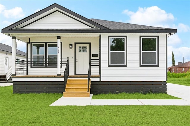 2305 Weyer St, Gretna, LA 70053 - view of front of house with a porch and a front yard