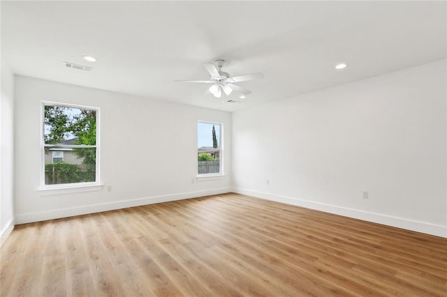 2305 Weyer St, Gretna, LA 70053 - spare room with baseboards, light wood-type flooring, ceiling fan, and recessed lighting