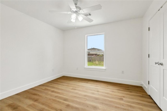 2305 Weyer St, Gretna, LA 70053 - empty room with baseboards, light wood-style floors, and ceiling fan