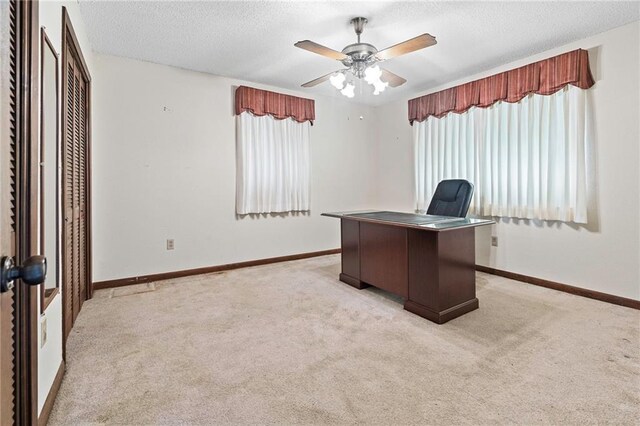 1816 Giuffrias Ave, Metairie, LA 70001 - unfurnished office featuring light carpet, a textured ceiling, ceiling fan, and baseboards