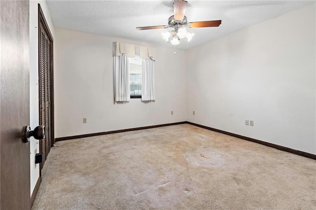 1816 Giuffrias Ave, Metairie, LA 70001 - unfurnished bedroom with carpet, a closet, a textured ceiling, baseboards, and ceiling fan