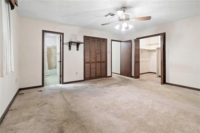 1816 Giuffrias Ave, Metairie, LA 70001 - unfurnished bedroom with carpet flooring, baseboards, a textured ceiling, and connected bathroom