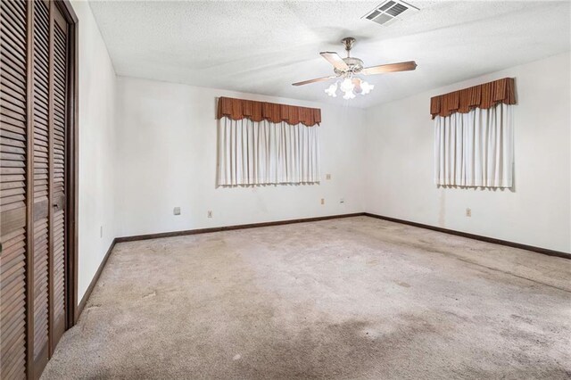 1816 Giuffrias Ave, Metairie, LA 70001 - unfurnished bedroom with a closet, carpet floors, baseboards, ceiling fan, and a textured ceiling