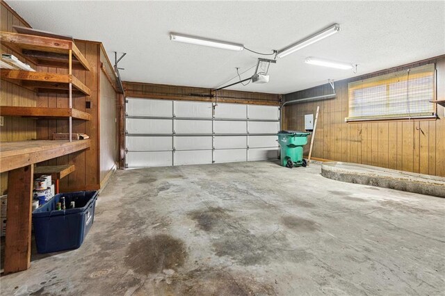 1816 Giuffrias Ave, Metairie, LA 70001 - garage with wood walls and a garage door opener
