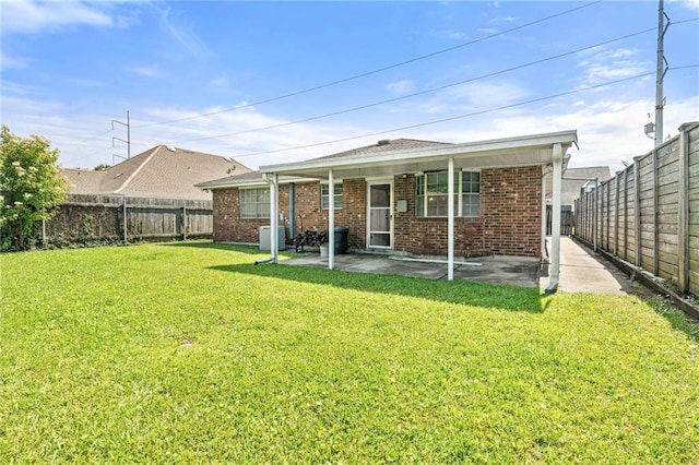 1816 Giuffrias Ave, Metairie, LA 70001 - rear view of property featuring brick siding, a patio area, and central AC