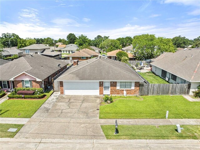 1816 Giuffrias Ave, Metairie, LA 70001 - view of front of home with brick siding, a residential view, an attached garage, and driveway