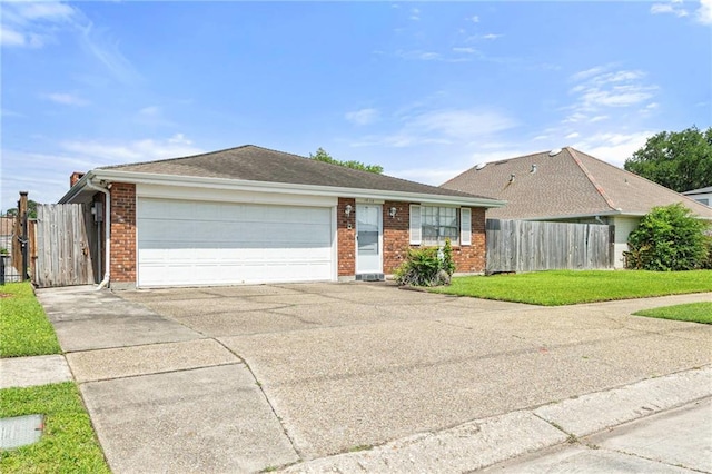 1816 Giuffrias Ave, Metairie, LA 70001 - ranch-style house featuring an attached garage, concrete driveway, brick siding, and a gate