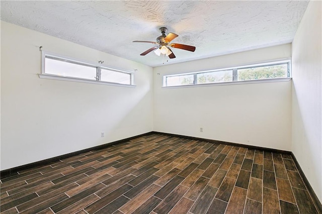 1501 Poinsettia Dr, Metairie, LA 70005 - spare room with a ceiling fan, dark wood-style floors, and baseboards