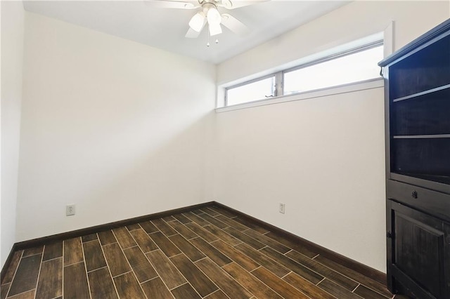 1501 Poinsettia Dr, Metairie, LA 70005 - empty room with ceiling fan, dark wood finished floors, and baseboards