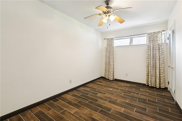 1501 Poinsettia Dr, Metairie, LA 70005 - spare room featuring dark wood finished floors, ceiling fan, and baseboards