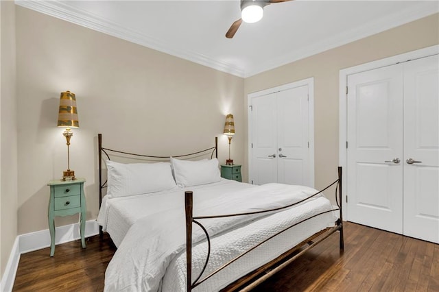 220 Decatur St Unit 302, New Orleans, LA 70130 - bedroom featuring multiple closets, hardwood / wood-style floors, crown molding, ceiling fan, and baseboards