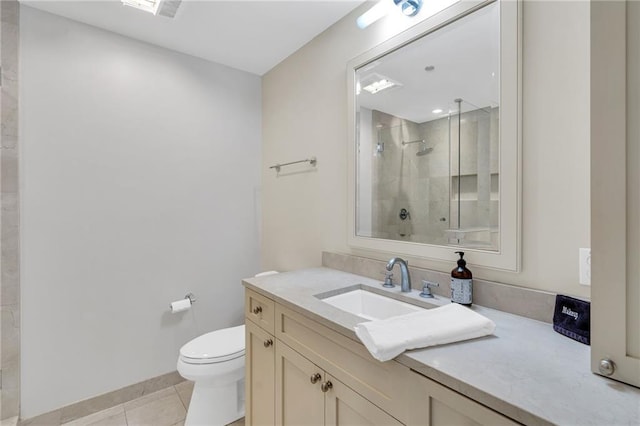 220 Decatur St Unit 302, New Orleans, LA 70130 - bathroom featuring a stall shower, vanity, tile patterned floors, toilet, and baseboards
