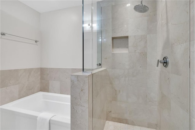 220 Decatur St Unit 302, New Orleans, LA 70130 - bathroom featuring a bath and a tile shower