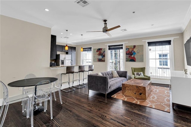 220 Decatur St Unit 304, New Orleans, LA 70130 - living area with crown molding, dark wood-style flooring, ceiling fan, recessed lighting, and baseboards